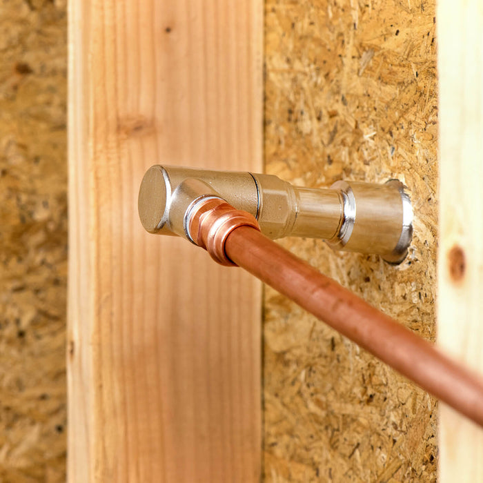 The backend of an Aquor hydrant showcasing a half inch NPT Elbow Inlet connected to copper piping.