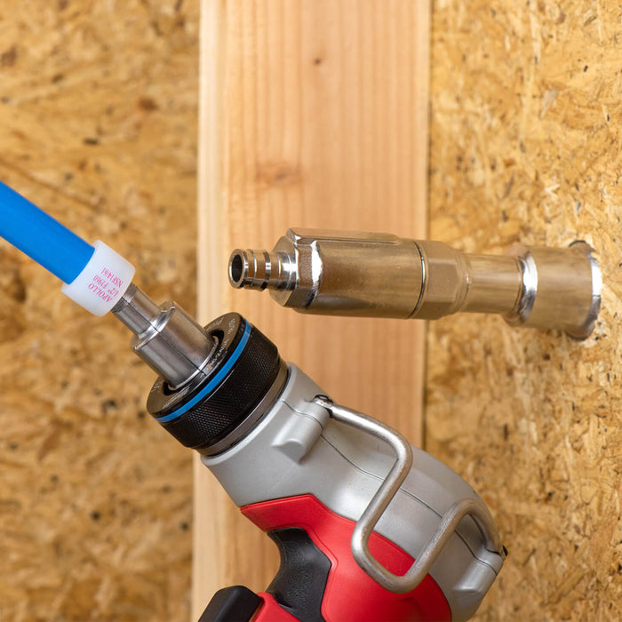 A PEX expander tool expanding PEX line to connect to a half PEX expansion inlet.