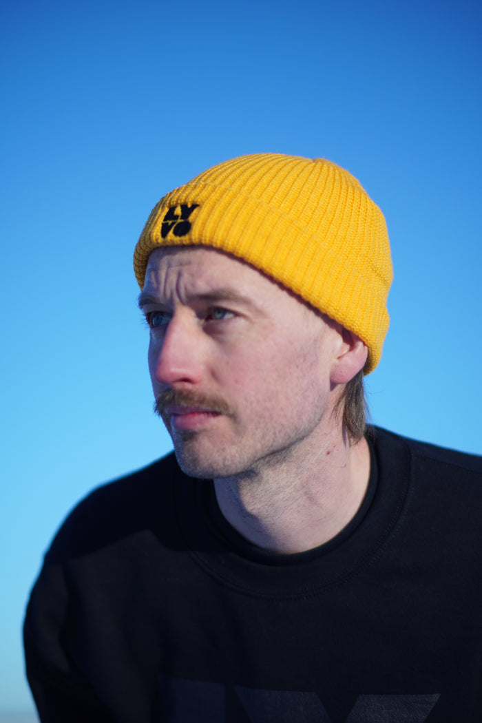 Lyvo Cycling Block Fisherman beanie with embroidered design, warm knit fabric, and a classic fisherman style for outdoor wear.
