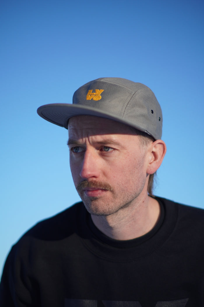 Lyvo Cycling Block Trucker Hat featuring a mesh back and adjustable strap, stylish and breathable for casual wear.