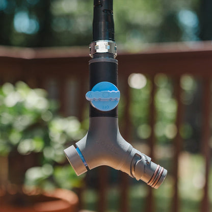 A Comfort Grip vb hose connector and hose hanging.|47799622369530