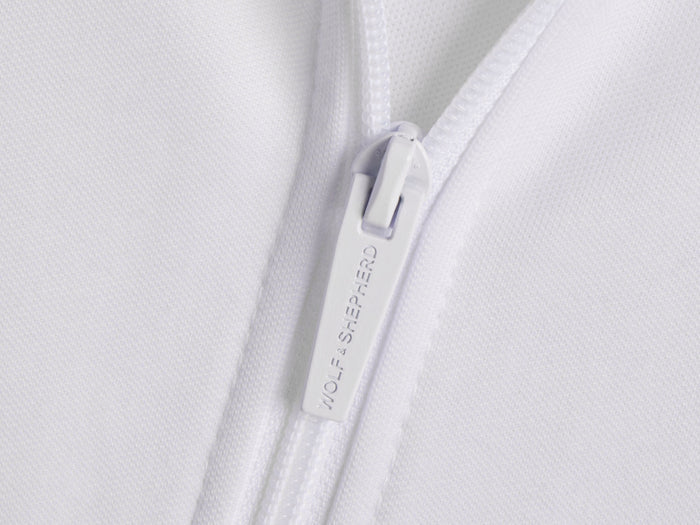 Americana // Close-up of zipper pull with Wolf & Shepherd branding