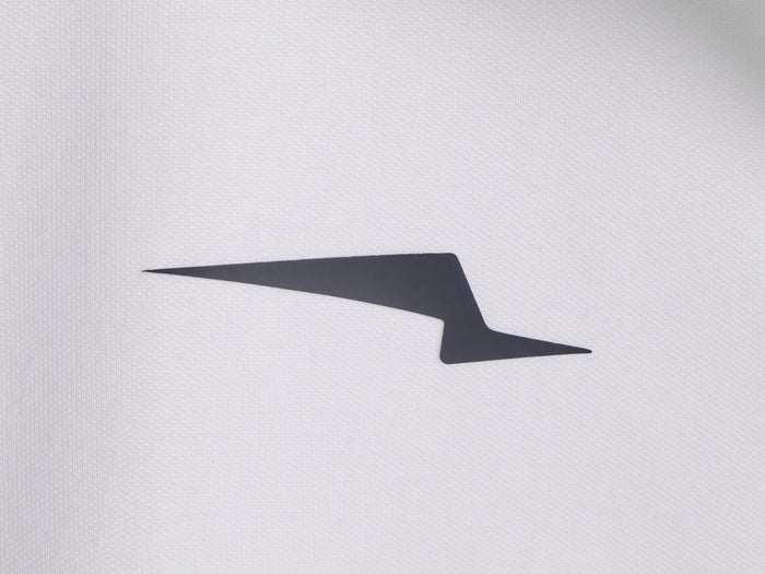Americana // Close-up of Wolf & Shepherd wing logo on jacket fabric