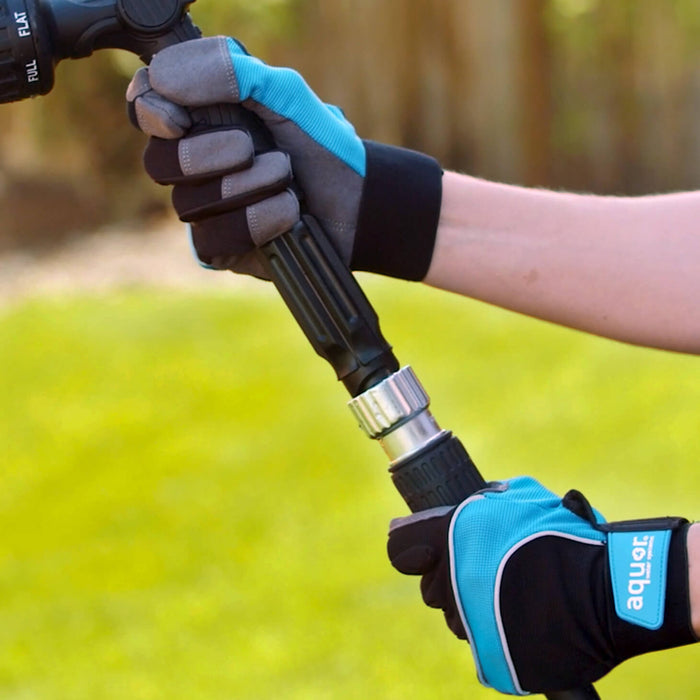 Two hands connecting the hose adapter to attach a spray nozzle.|42444323586298