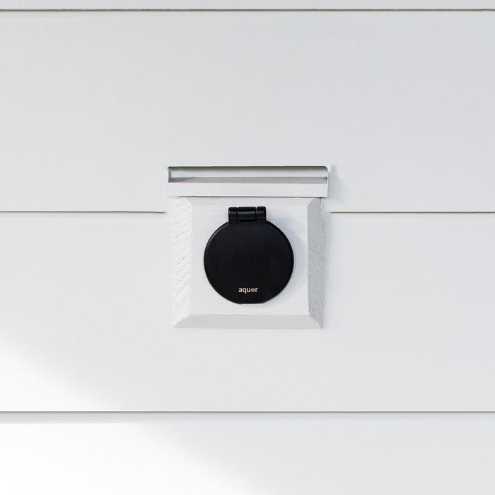 A matte black v1+ debris cover shown on white lap siding.|47730978717946
