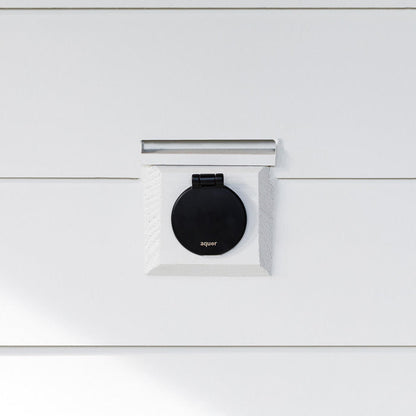 A matte black v1+ debris cover shown on white lap siding.|47730978717946