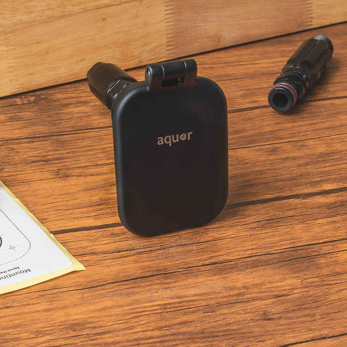 A matte black v2+ debris cover shown sitting on a table.|47730985828602